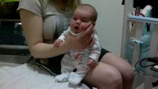 Mommy burps the baby after drinking milk