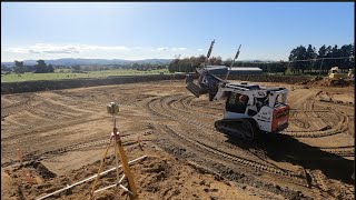 BOBCAT with laser grader trimming housepad