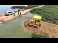 Whole it is impressive that the komatsu dozer crew can even pour stone to create water road