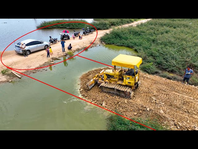 Whole video!! It is impressive that the KOMATSU Dozer crew can even pour stone to create water road class=