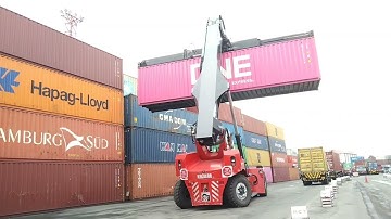 Kalmar Reach stacker with a tilting spreader for container handling
