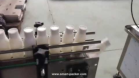 Automatic milk plastic bottle wheel rolling capping machine with cap feeder testing video