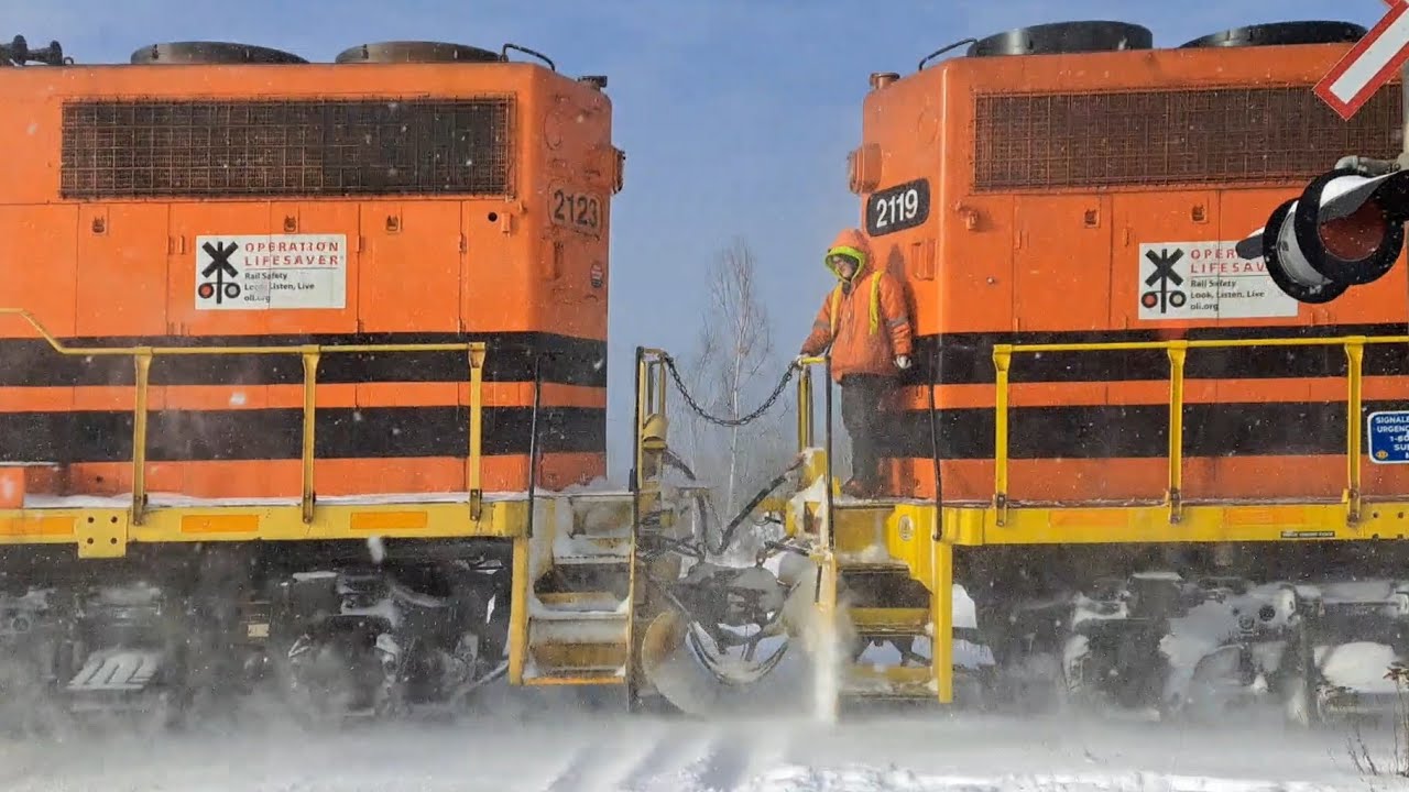 Why Was Someone Standing There Between Two Engines On A Moving Train?