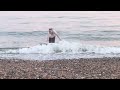 Graciously exiting the sea at Brighton Beach - swimming fully clothed in the sea ( sea swim)