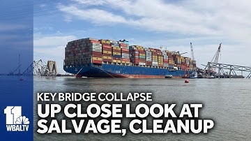 Bridge collapse crews work to clear channel, remove wreckage