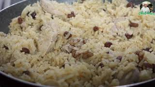 وجبة  الأرز الأبيض مع فتايل الدجاج  المقطع باللوز والجوز والبندق والزبيب الأحمر المجفف