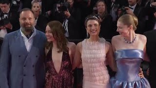 Emma Stone and co-stars dance on red carpet after 'Kinds of Kindness' Cannes premiere