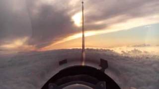 F16 barrel roll under sunrise