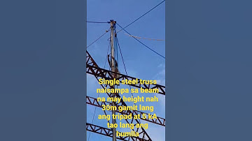 steel truss lifted by 5 men using tripad