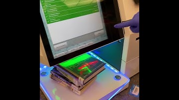 Using our new self-checkout machines to check out library materials