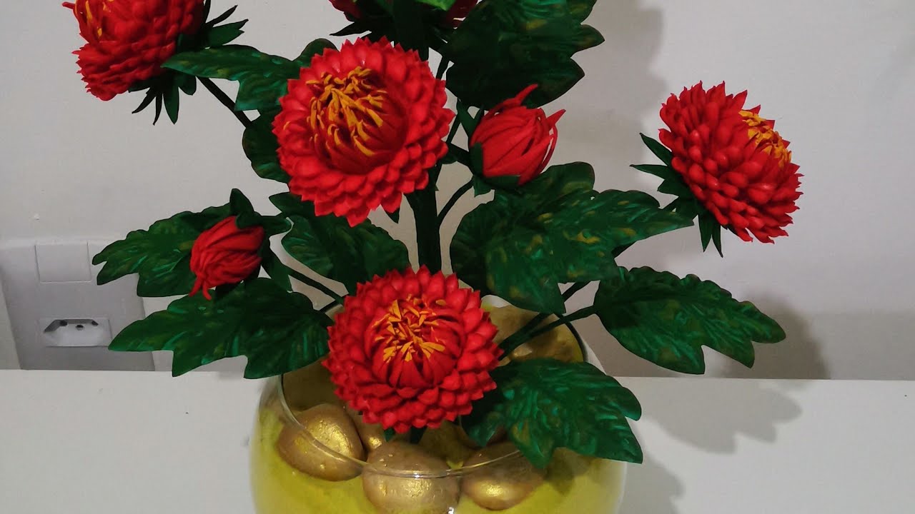 como fazer uma linda flor com  nome gérbera utilizando frisador.