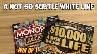 A not so subtle white line | 1 x $20 Monopoly Jackpot & 1 x $20 $10,000 a Week for Life