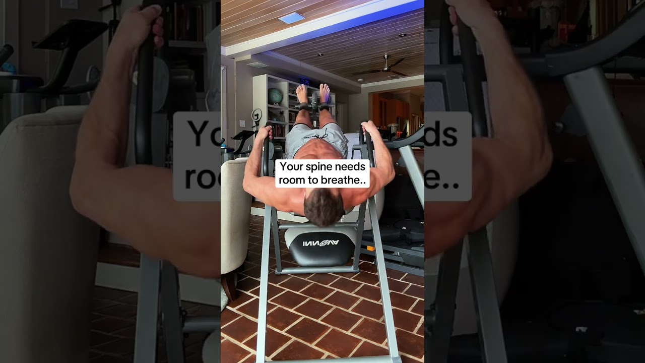 The Sunny Health & Fitness Full Body Stretch Decompression Bench lays flat on the ground and uses a