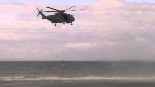 AgustaWestland Merlin helicopter lowering / raising winchman at Ayr beach - Scottish air show