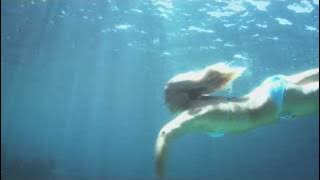 Swimming girl is in for a surprise