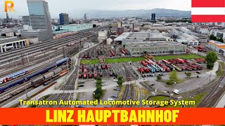 Aerial View: Linz Hbf - The Futuristic Transatron Automated Locomotive Storage System in 4K Aerial View: Linz Hbf - The Futuristic Transatron Automated Locomotive Storage System in 4K