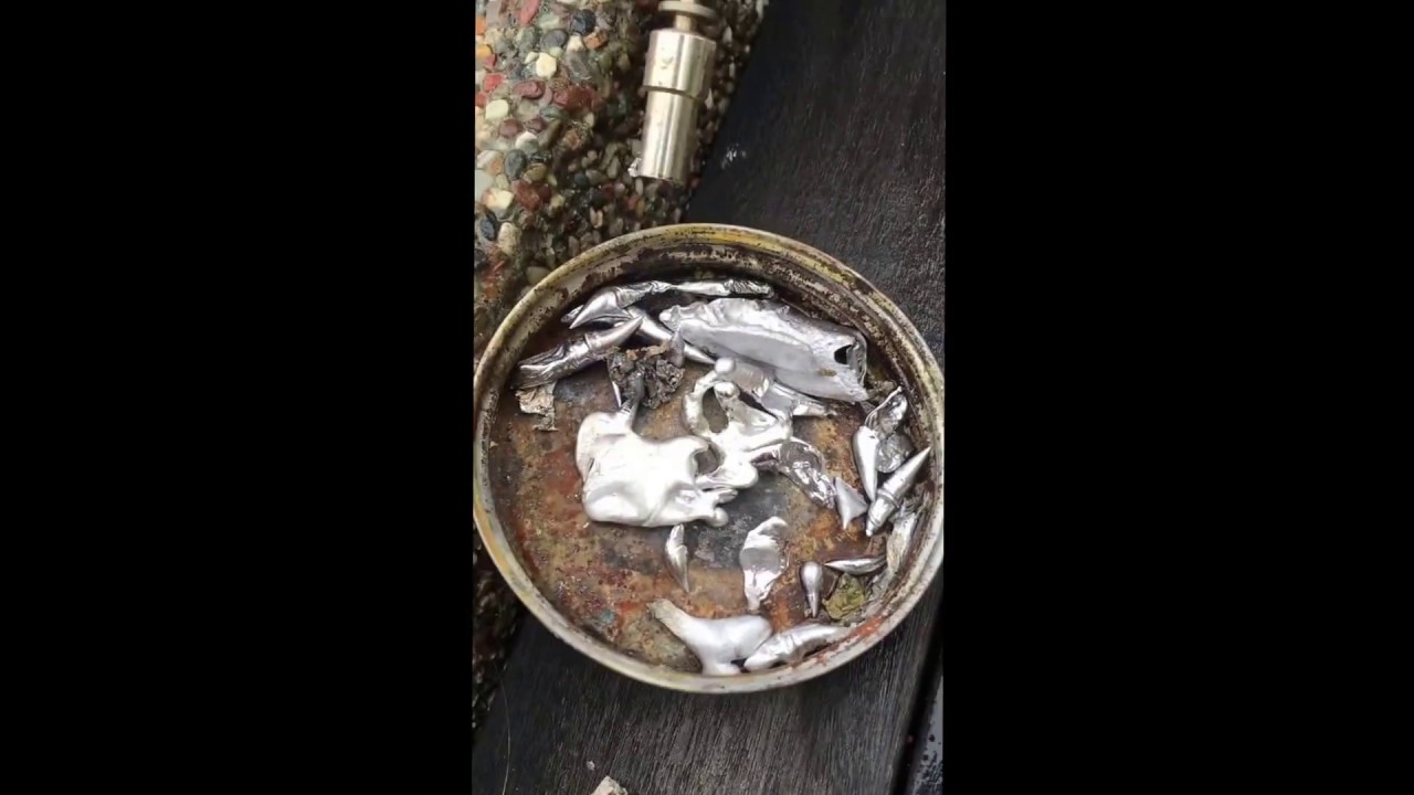 pouring molten metal into water