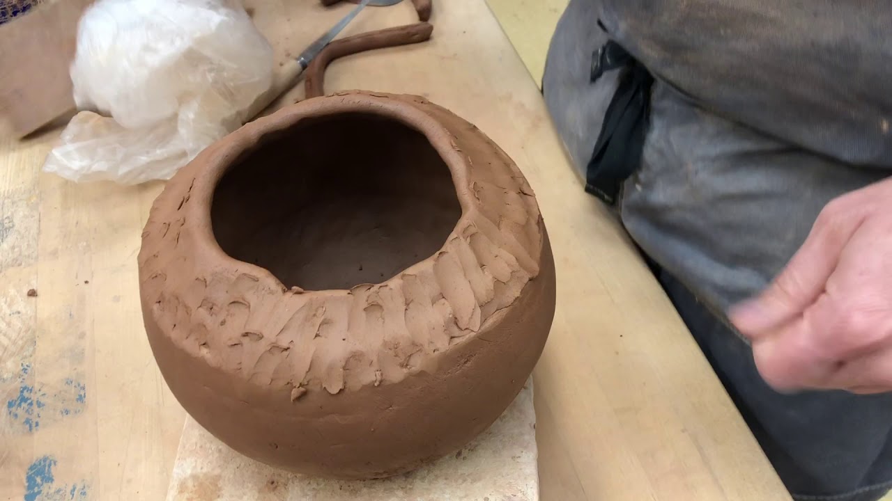 Coil pot with burnished black slip