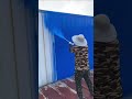the process of repainting the spandek fence walls of a building using a spray #construction #popular