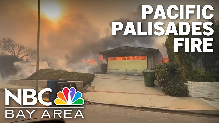 Fast-moving wildfire in Southern California destroys structures