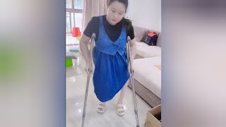 The beautiful woman suffering from polio bravely challenges disability and walks on crutches #polio