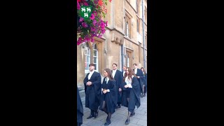 Oxford University students celebrate their graduation at Jesus College