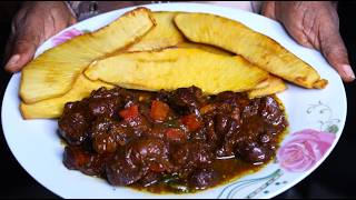 Stewed Chicken Gizzards Served with Fried Breadfruit
