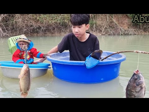 Abu with friend rowes boat fishing to feed Bingo dog