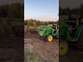 Big O helping grade dirt up to the new pool fence with the John Deere 3026e. Thanks to 4wd!!