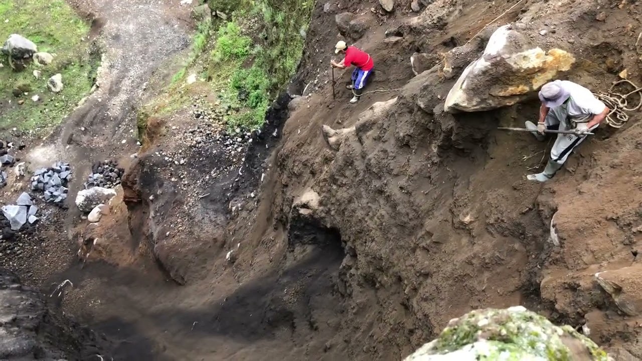 Amazing miners..!!! Drop a large rocks from a cliff