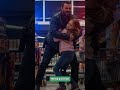Girl Gives A Distress Signal in Front Of A Bodybuilder