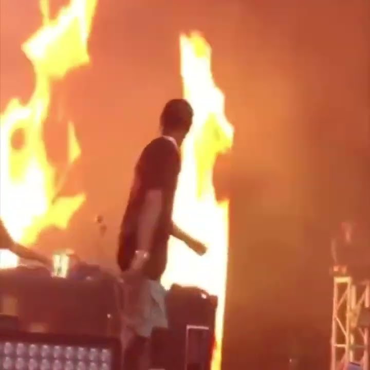 Travis Raging Travis Scott raging and throwing something in front of a background of ...