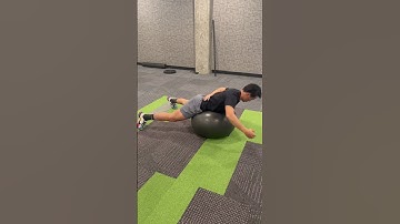 Prone back extension over ball with full arm and trunk rotation