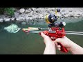 Fishing with mechanical slingshot rifle and darts.