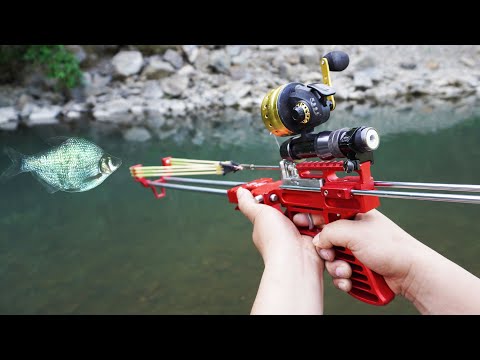 Fishing with mechanical slingshot rifle and darts. 