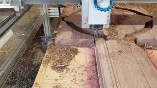 CNC router cutting 2" thick black walnut wood