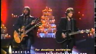 Bon Jovi performing Living on a prayer in &quot;America: a Tribute to Heroes 911