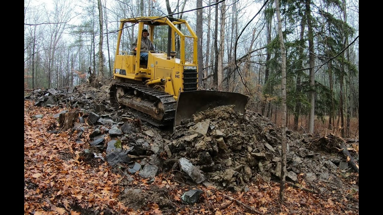Pushing in a new driveway with a dozer