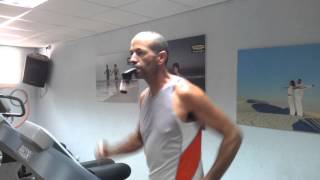 Triathlete Tomer Baskind using POWERbreathe IMT on treadmill