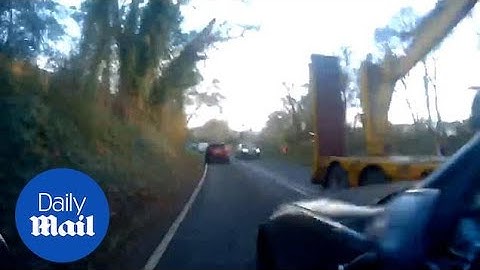 Cyclist screams as BMW overtakes and nearly crashes into oncoming truck
