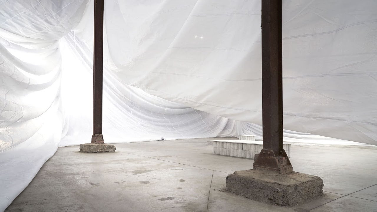 Abandoned Industrial Building Repurposed Using Scaffolding Tarps to