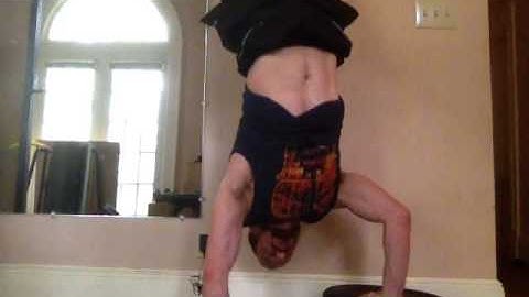 Left hand uneven handstand push-ups convict conditioning