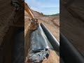 Geomembrane Liner Installation | HDPE Sheet Deployment on Slope