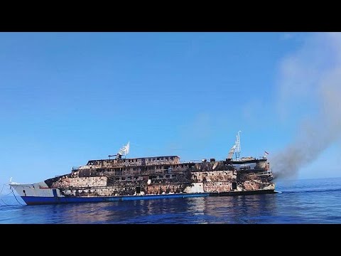 Indonesia ferry catches fire, passengers jump to sea