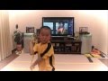 my son acting Bruce Lee's Game Of Death Nunchaku