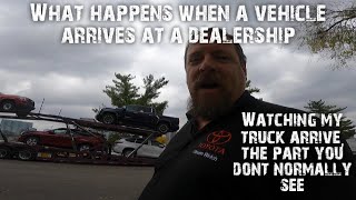 What happens as a vehicle arrives at the dealership