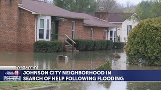Johnson City neighborhood in search of help following flood and disagreement with a neighbor and the