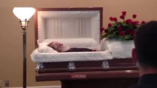 Dead guy moving inside coffin