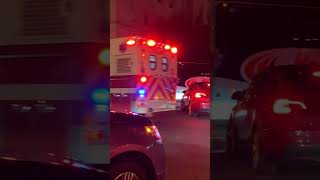 District of Columbia paramedic department going code 3 through a busy intersection