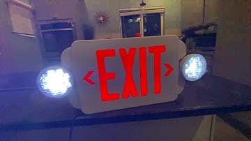 Slow-mo of a exit sign going to to emergency mode